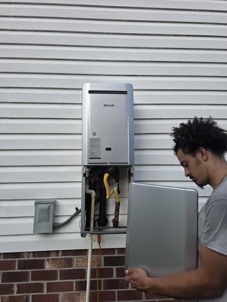 Exterior Rinnai tankless water heater installation in progress